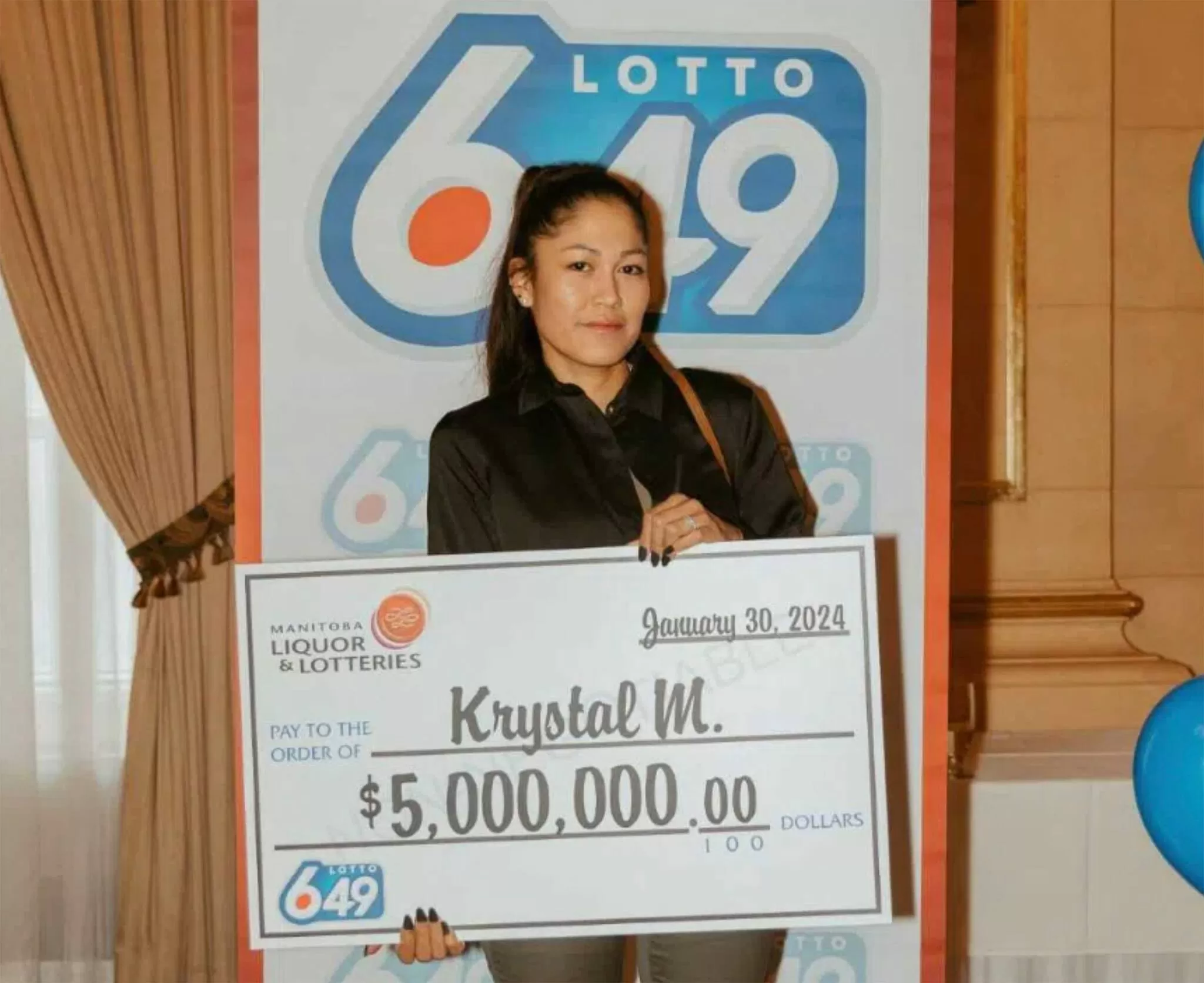 Krystal McKay claiming her $5 million Lotto 6/49 lottery prize after the January 2024 draw