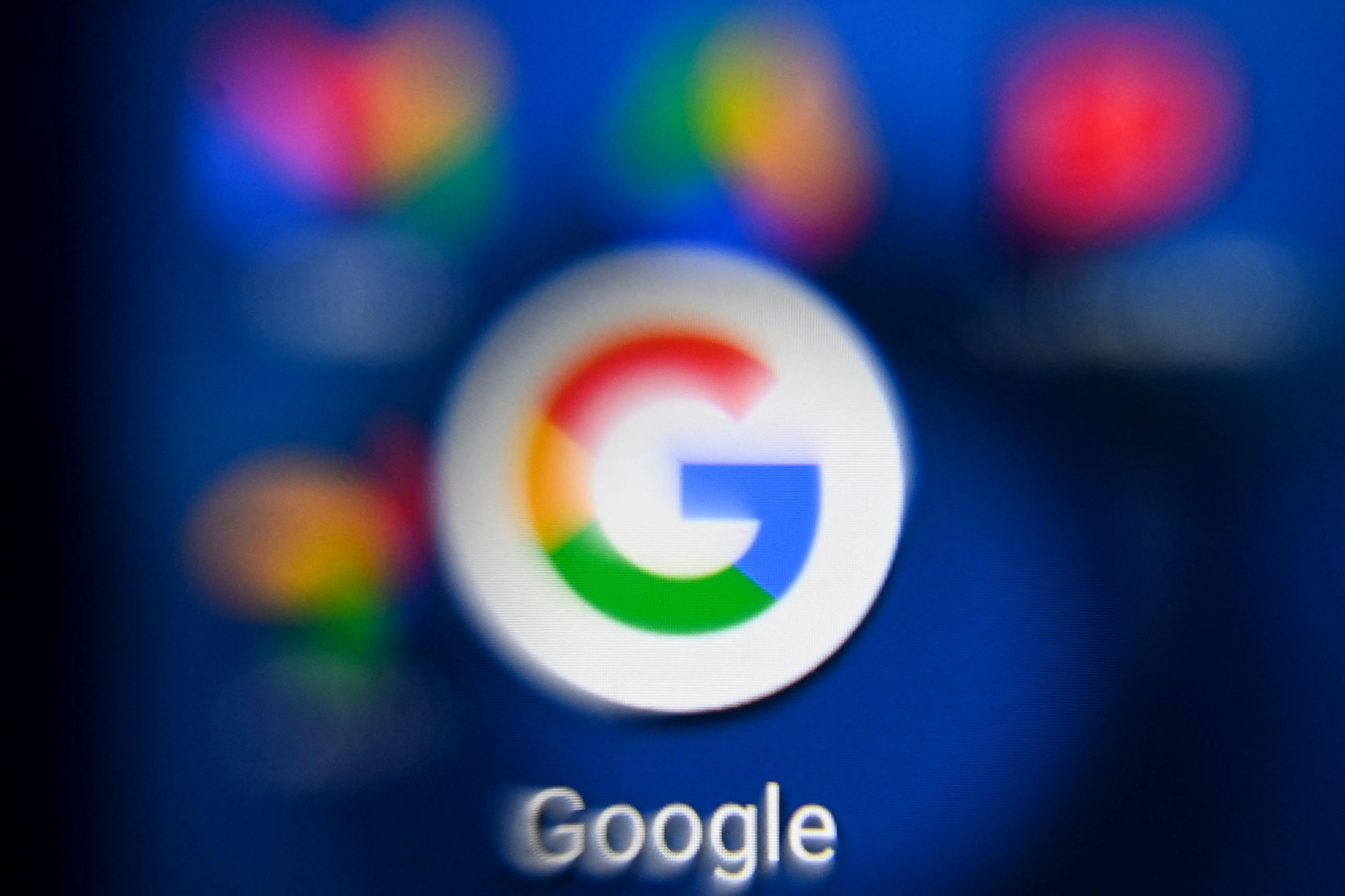 Google app icon displayed on a smartphone screen, symbolizing online account access and security.