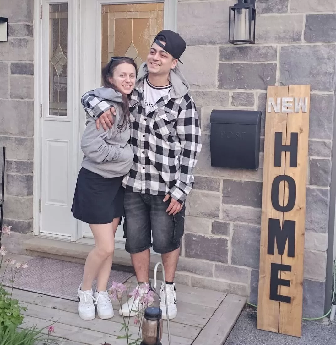 First-time homebuyers Steven and Celine celebrating buying their first house