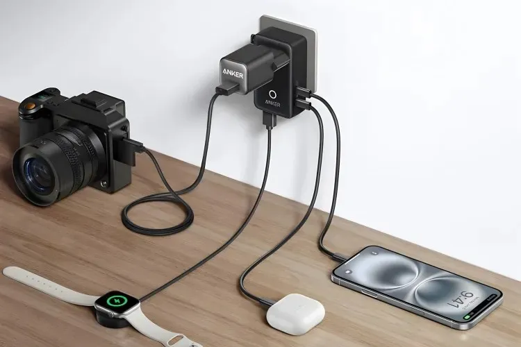 Compact Anker Nano Travel Adapter with various international plug types and charging ports.