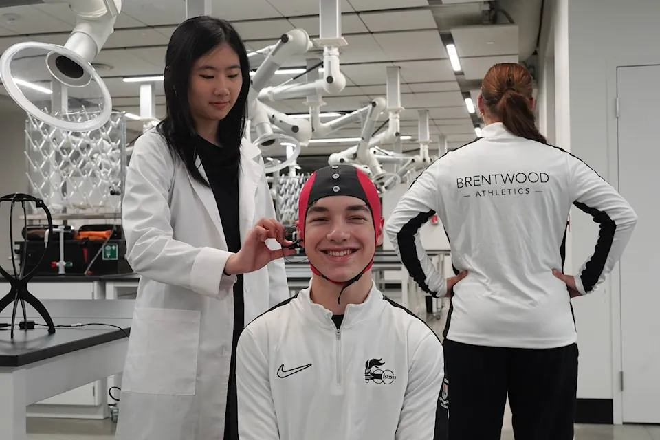 High school students work on a neuroscience study using brain-scanning technology.