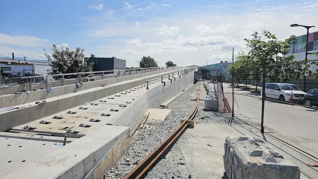 Elevated guideway transitioning to underground tunnel construction