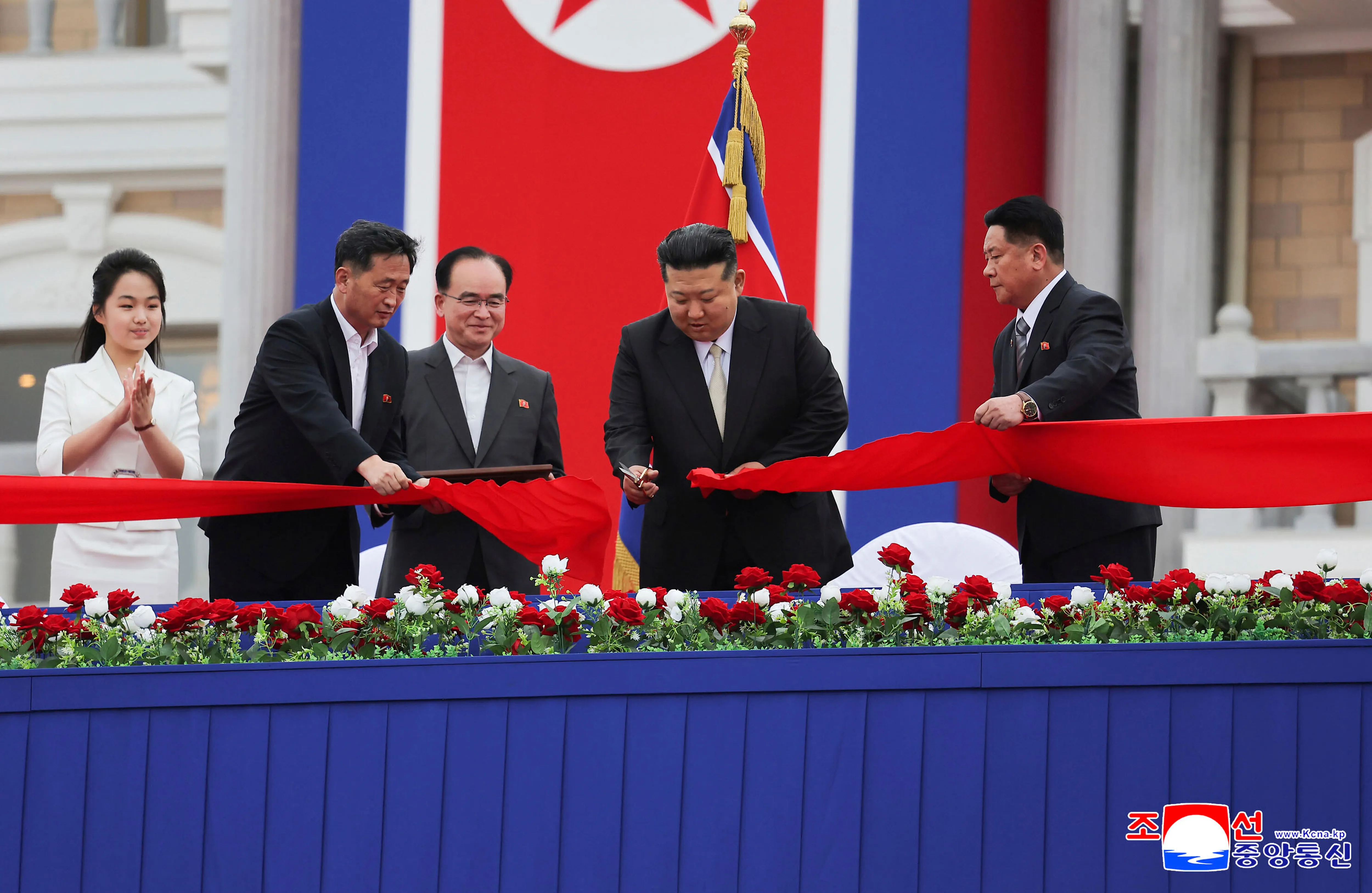 North Korean leader Kim Jong Un and his daughter attend the inauguration ceremony for the Wonsan-Kalma coastal tourist zone on June 24, 2025, cutting the ribbon to open the facility.