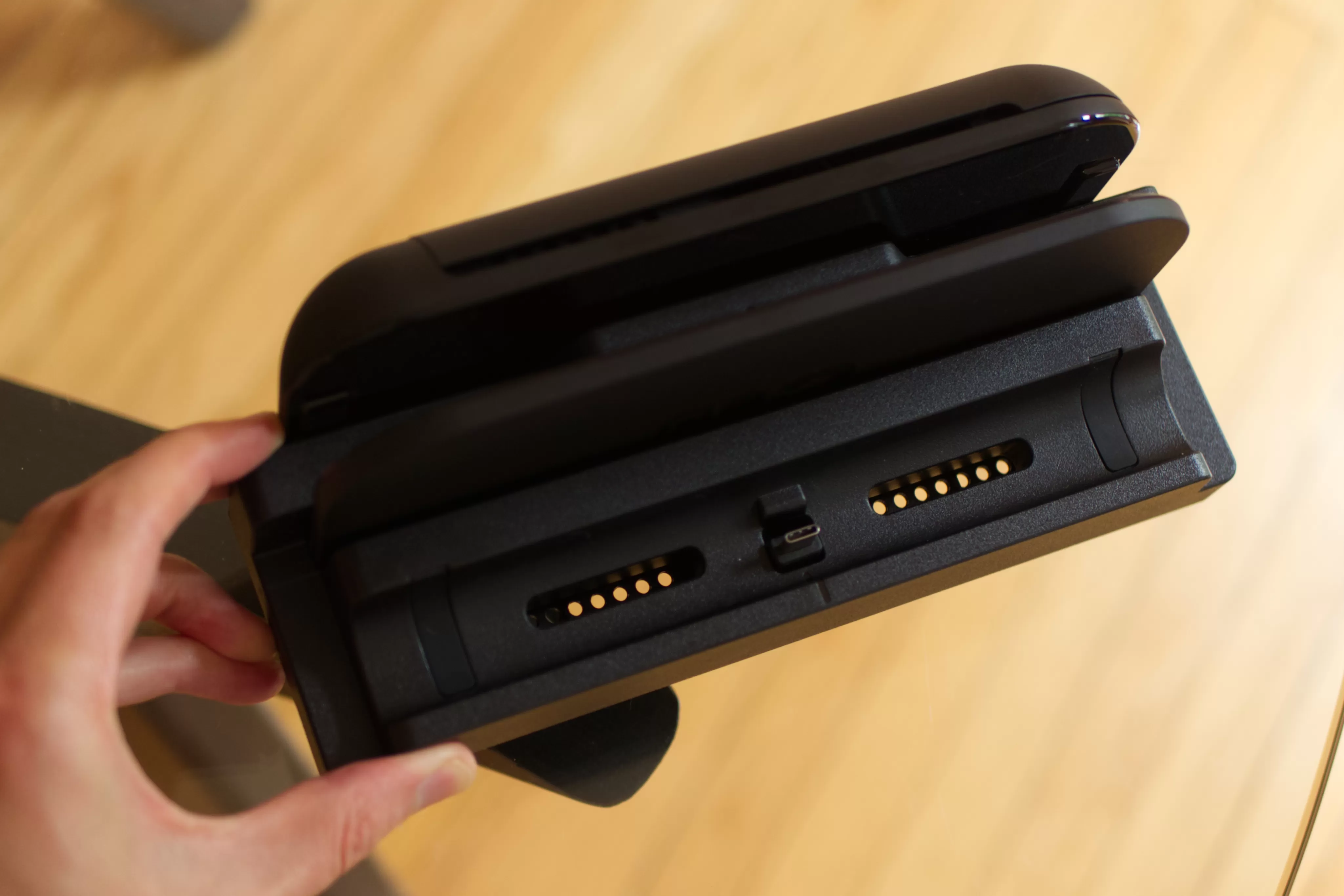 A top-down image shows the Nintendo Switch 2 dock with Dbrand’s Killswitch USB-C dock adapter connected to the front port.