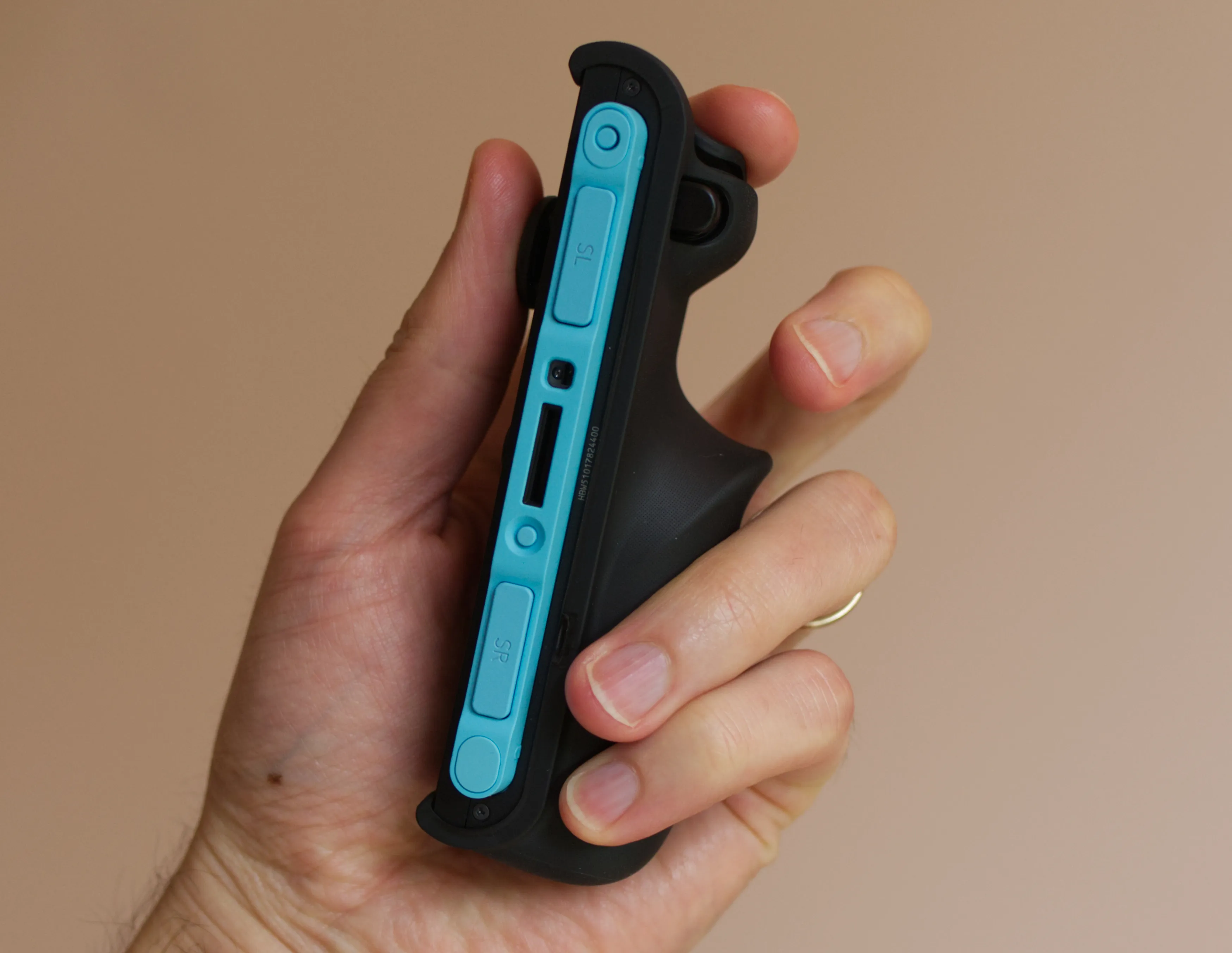 A close-up photo shows a Dbrand Killswitch grip attached to a Nintendo Switch 2 Joy-Con.