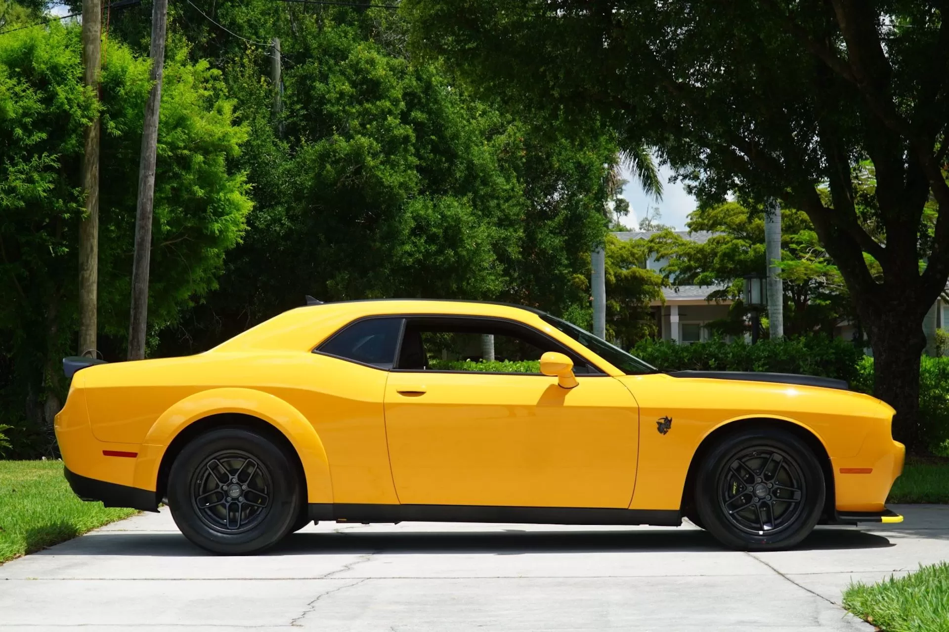 Striking Cream Sickle 2023 Dodge Challenger SRT Demon 170 Jailbreak with carbon fiber wheels on display.