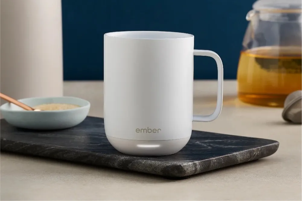White Ember Mug 2 temperature-controlled mug with its charging coaster