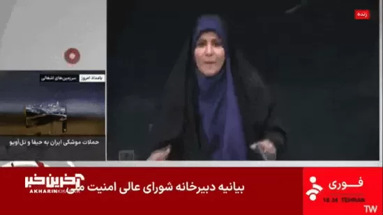 Dust and debris fill a television studio during a live broadcast in Tehran following a reported Israeli strike on the building housing Iran's state broadcaster IRIB.