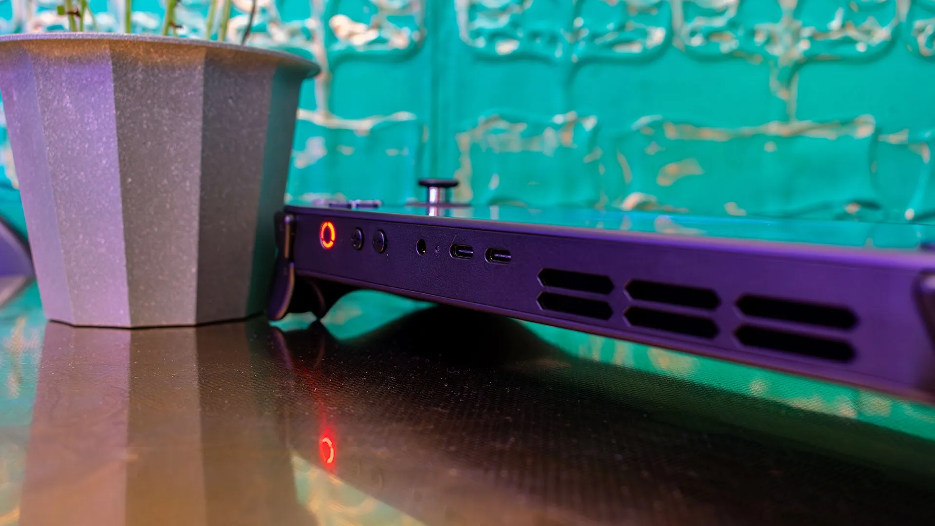 Lenovo Legion Go S in Nebula Nocturne purple next to a Steam Deck for size comparison