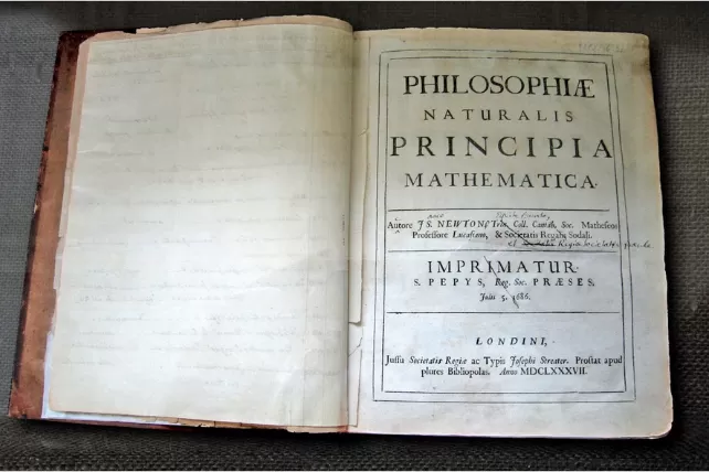Newton's annotated copy of Principia Mathematica open to his first law of motion.