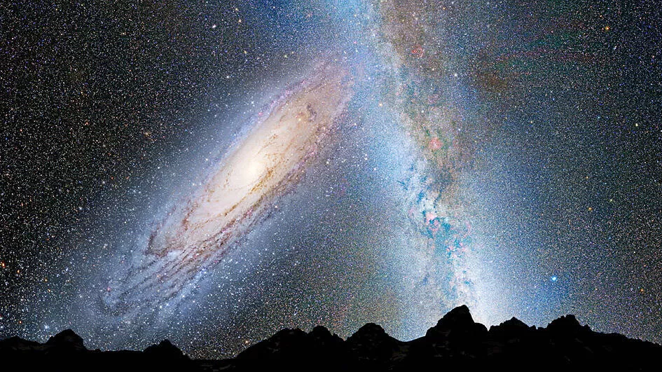 An artistic illustration shows two large spiral galaxies appearing to interact or merge in a distant night sky view.