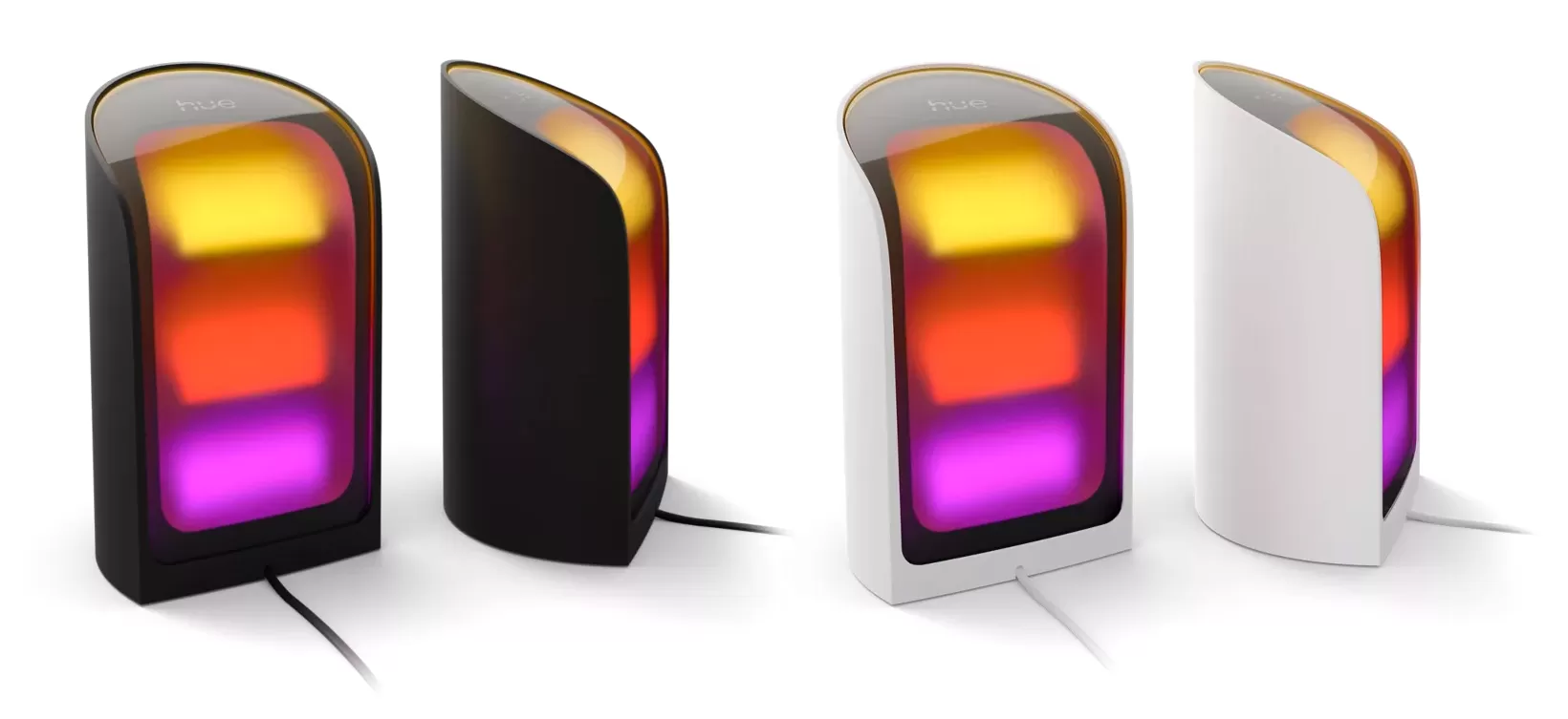 Two Philips Hue Play Wall Washer lights in black and white, positioned on the floor projecting light upwards.