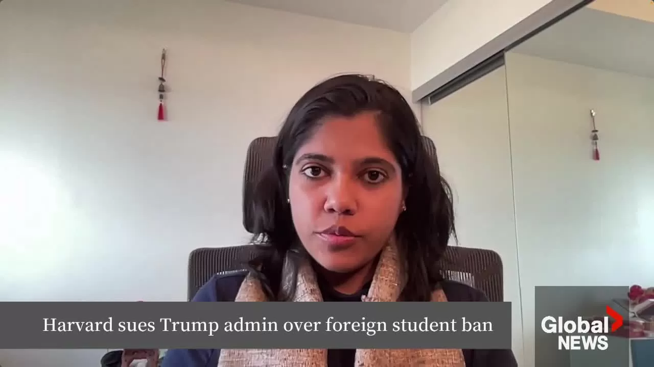 Students walk across Harvard University campus amidst uncertainty over visa policies