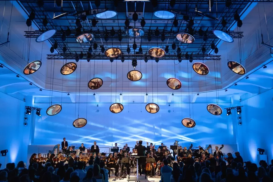 Vienna Symphony Orchestra performs The Blue Danube waltz on stage