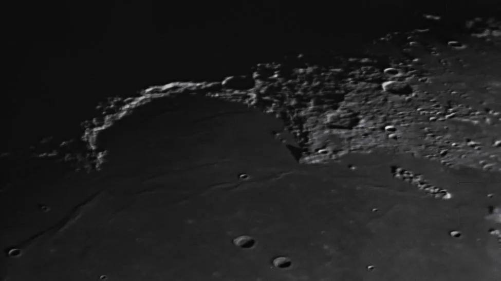 Golden Handle light effect on the moon's Montes Jura mountain range.
